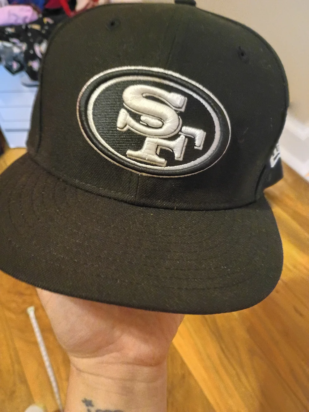 The New Era 59FIFTY San Francisco 49ers NFL Black Fitted Cap Hat in size 7 1/8